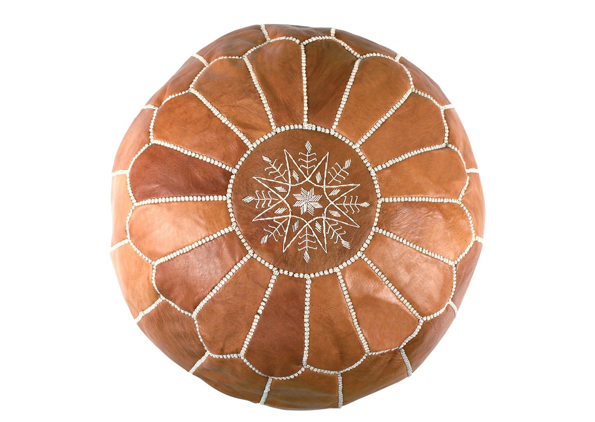 studio shot details of an authentic leather moroccan pouf made in the tanneries of Marrakech by berber artisans. 