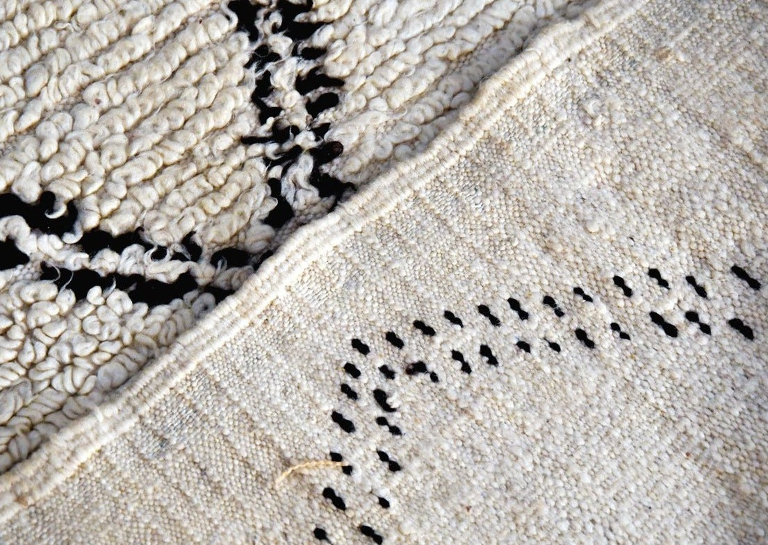 detail shot of classic beni ourain rug. both front and back of rug are shown here. 